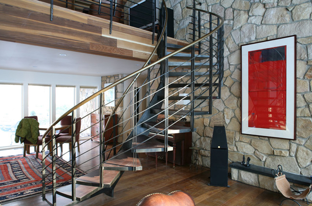 Bronze rail, blackened steel stringer, cantilevered treads.